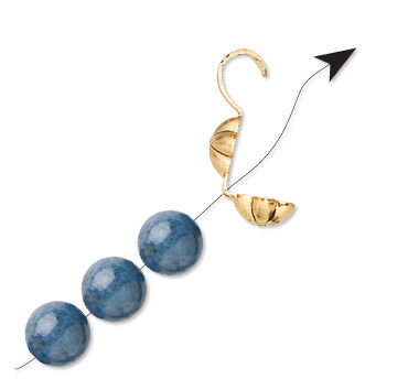 cord being strung through the back of a bead tip